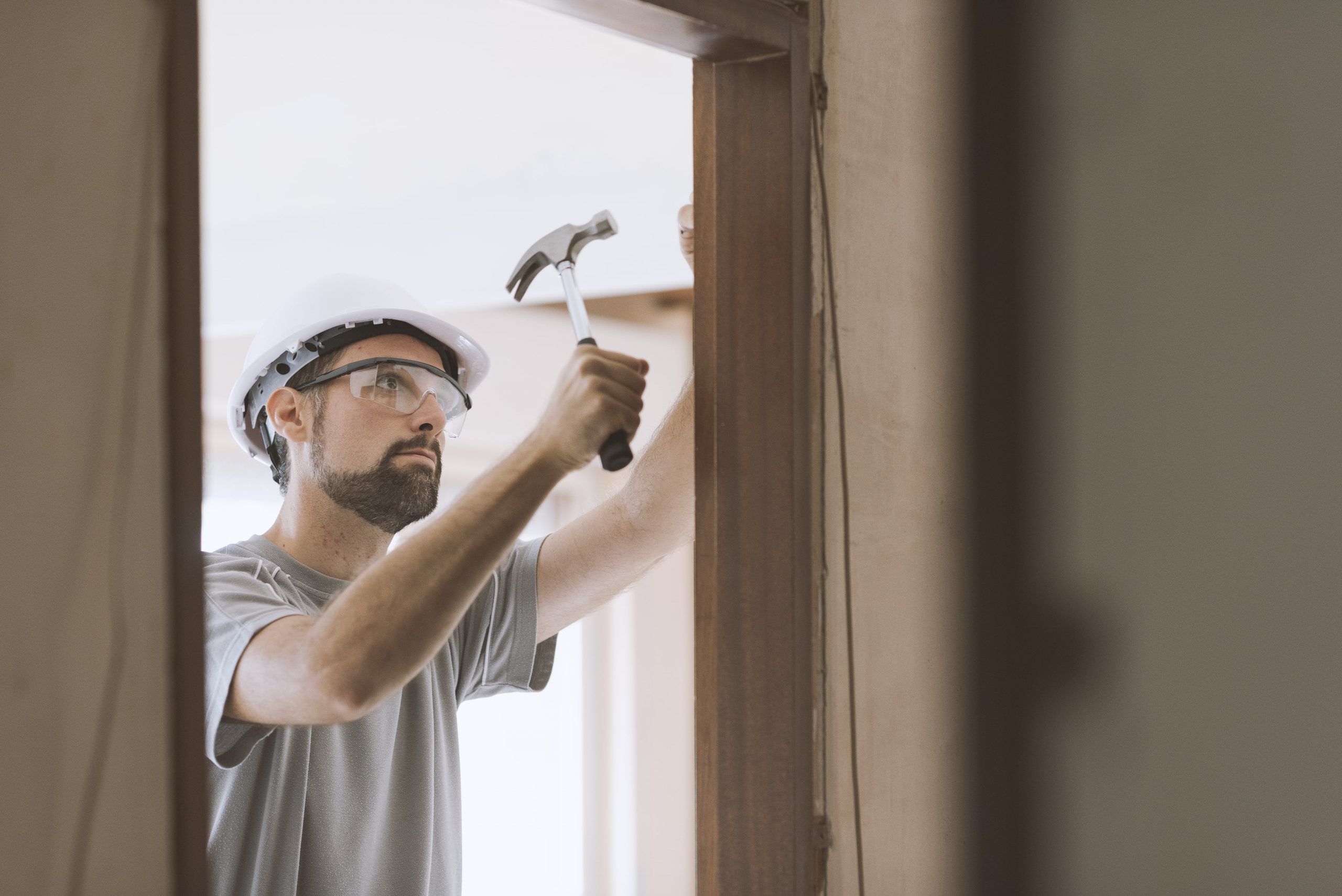 carpenter installing a door jamb at home 2021 08 26 22 39 57 utc min scaled