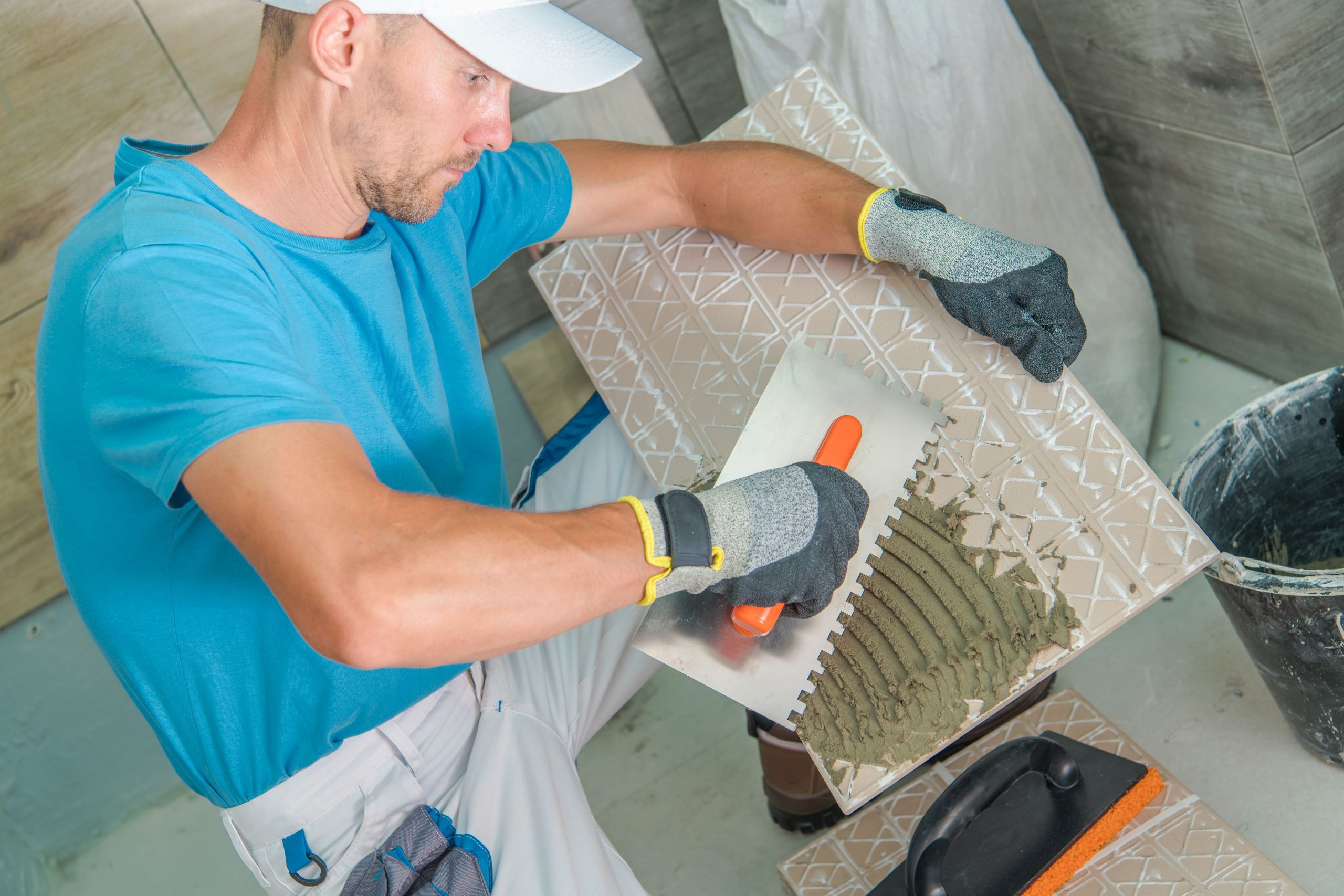 worker preparing the tile for installation 2022 10 26 03 40 12 utc min scaled